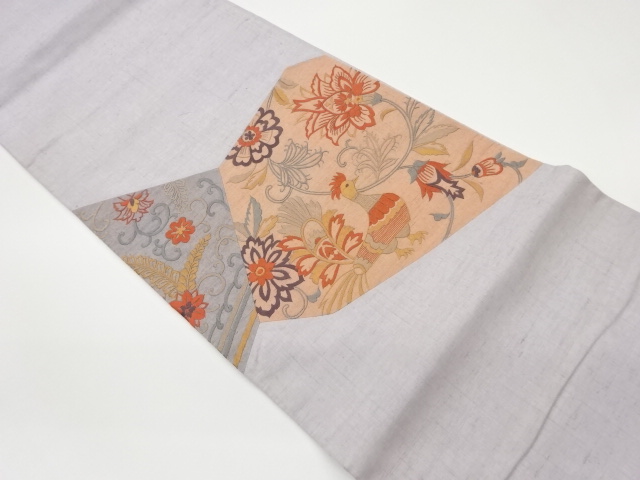 手織り紬切り嵌め孔雀に花唐草模様刺繍袋帯